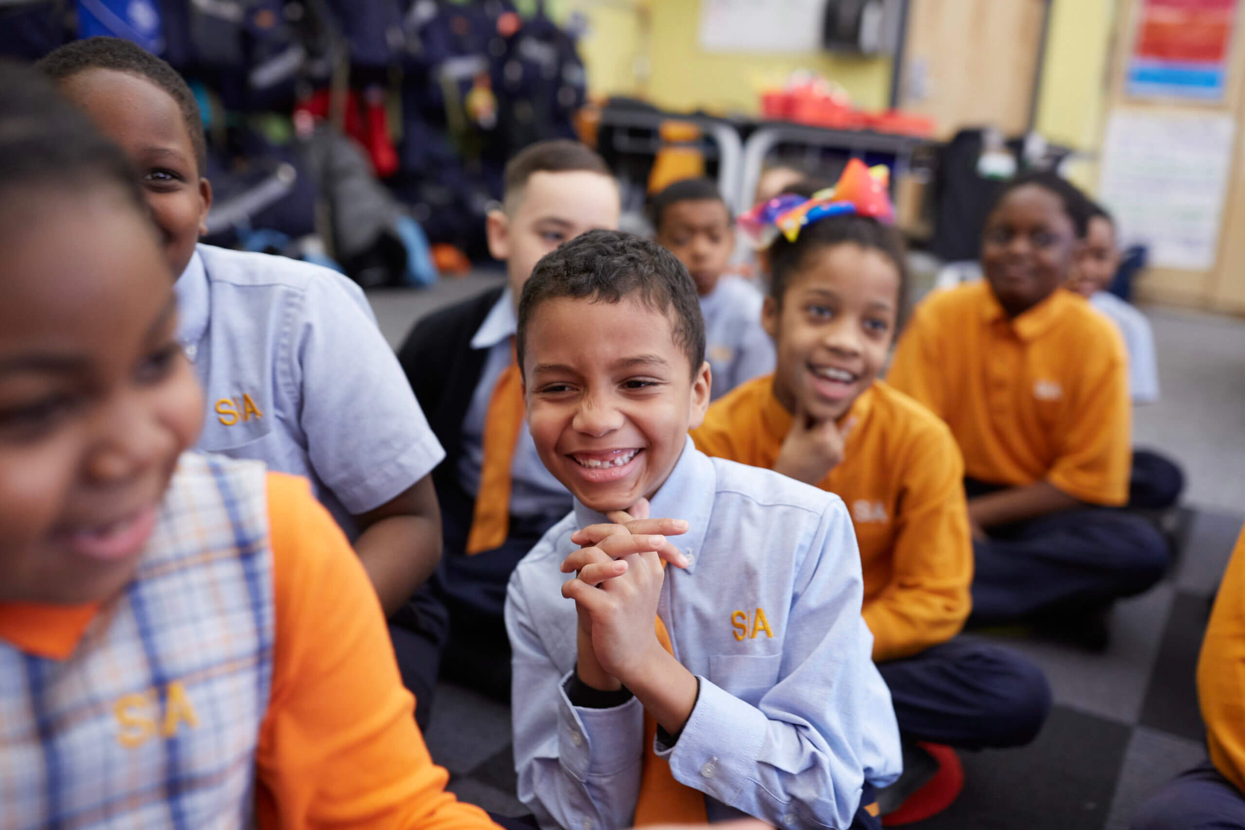 Students sitting in a group on the floor